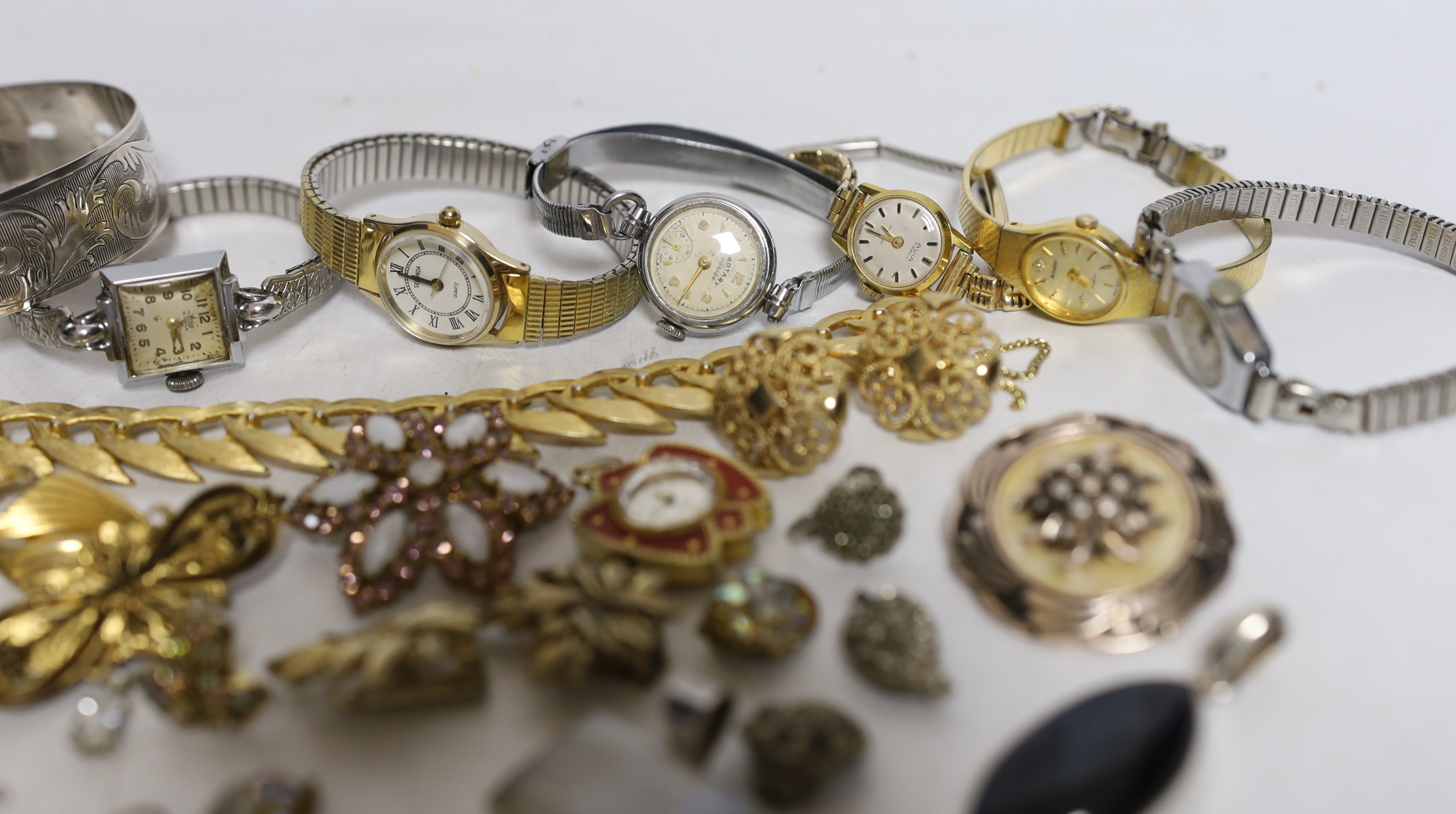 A mixed group of wrist watches including Rotary and 9ct gold Accurist and jewellery including 925 and costume.